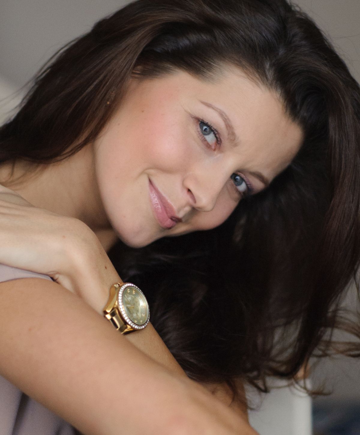 Portrait of a woman with long dark hair.