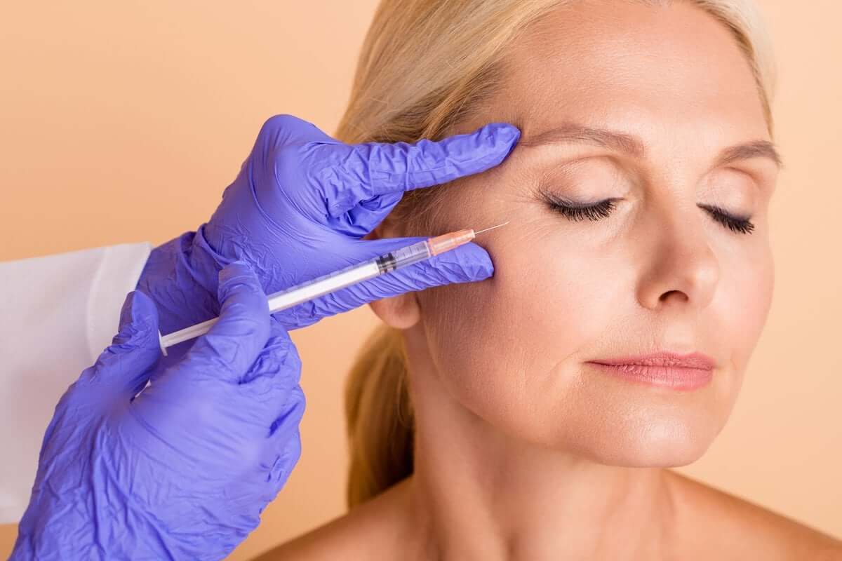 Woman with injection over cheek| Soul And Beauty Med X | Mission Viejo CA