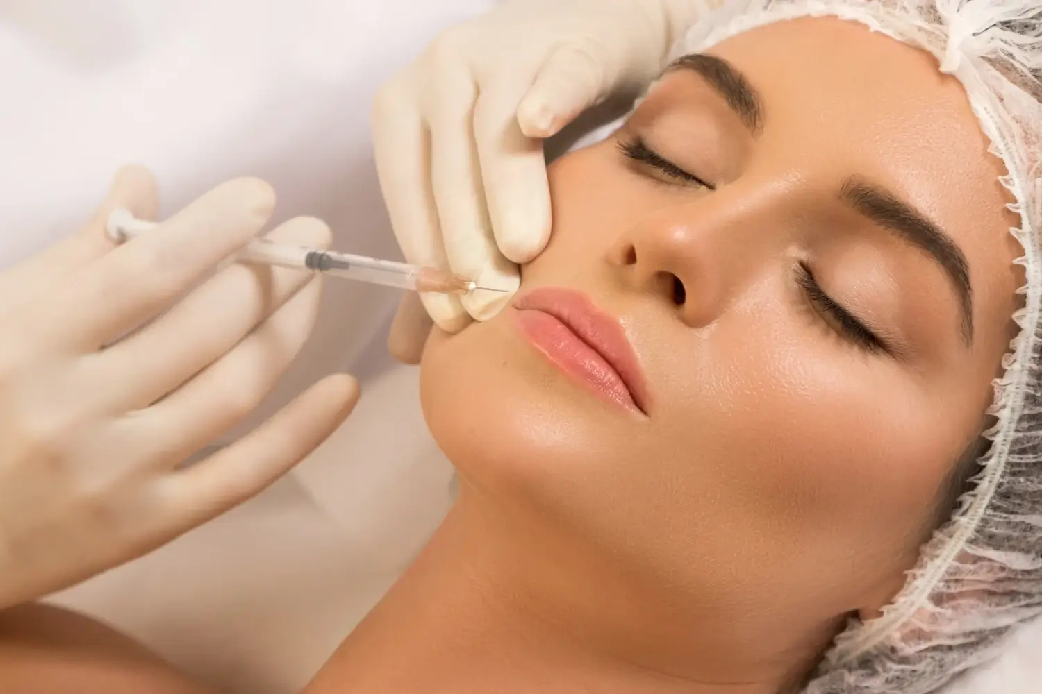Doctor providing injection over the lips if a women | soul and beauty medx. | Mission Viejo, CA
